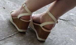 Chubby legs in high platform sandals.