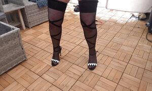Sexy Basque Heels and stockings and suspenders outdoors in the cold
