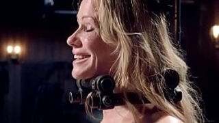 Milf gagged in metal stock whipped