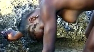 White guys fuck African babe on beach