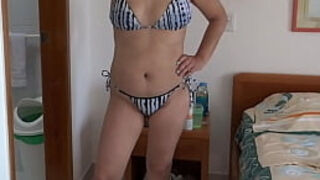 On the beach&comma; my stepmom in a bikini shows me her hairy pussy&comma; ass&comma; and tits&period;