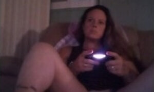 Busty Wife In Red Mini Dress Playing Video Games and Smoking Cigarettes