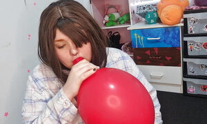 Girl Blowing up 3 huge balloons