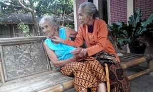 2 highly senior grandmas smooching