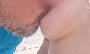 Wife goes topless on public beach and gets blowjob from a stranger