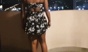 Flashing on a Hotel Balcony Keeping Her Dress Lifted up for Anyone to See